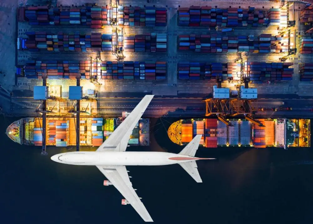 Ariel view of Container ships and transport aircraft in export and import business and logistics